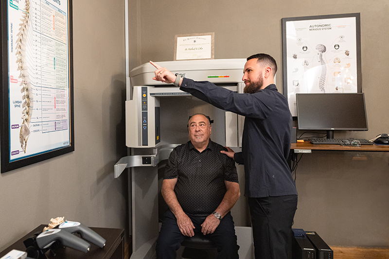 Explaining treatment to patient at Graceful Pompano Beach Chiropractic Image
